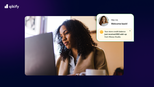a girl looking at the computer with store credit notification